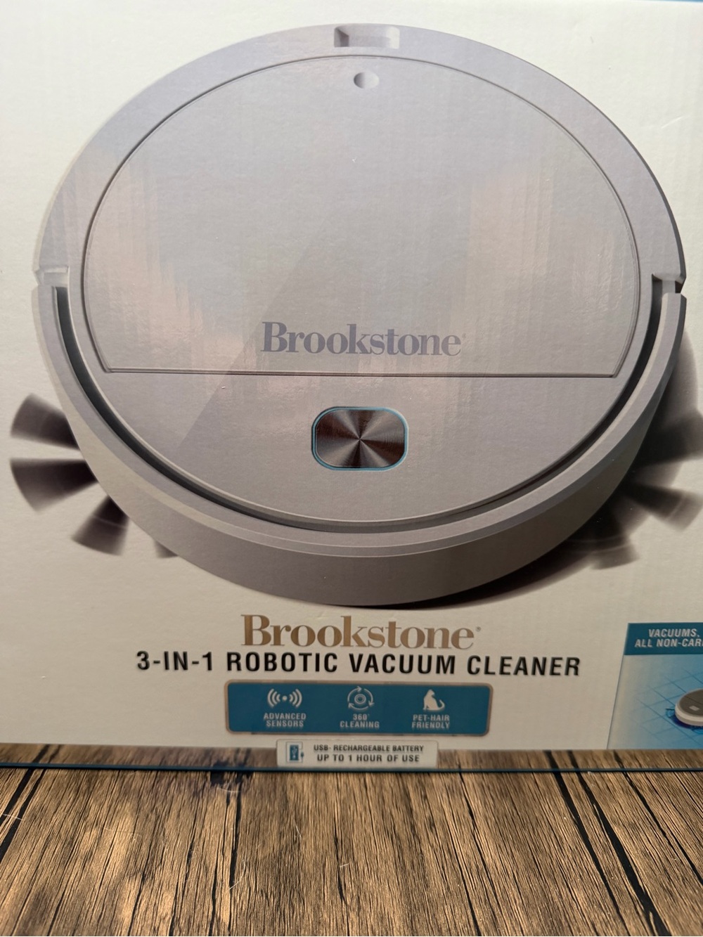 Brookstone robotic vacuum cleaner - light gray with blue accent